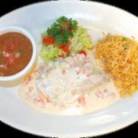 Pollo del Mar · Chicken breast filled with our seafood mix and topped with seafood sauce. Served with rice a...