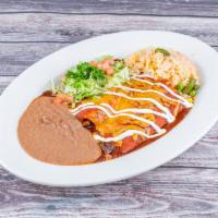 Enchiladas al Carbon · 2 pork, chicken or beef fajita enchiladas topped with red sauce and cheese. Served with rice...