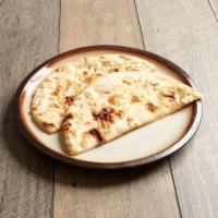 Naan · White flour bread baked in our tandoor.