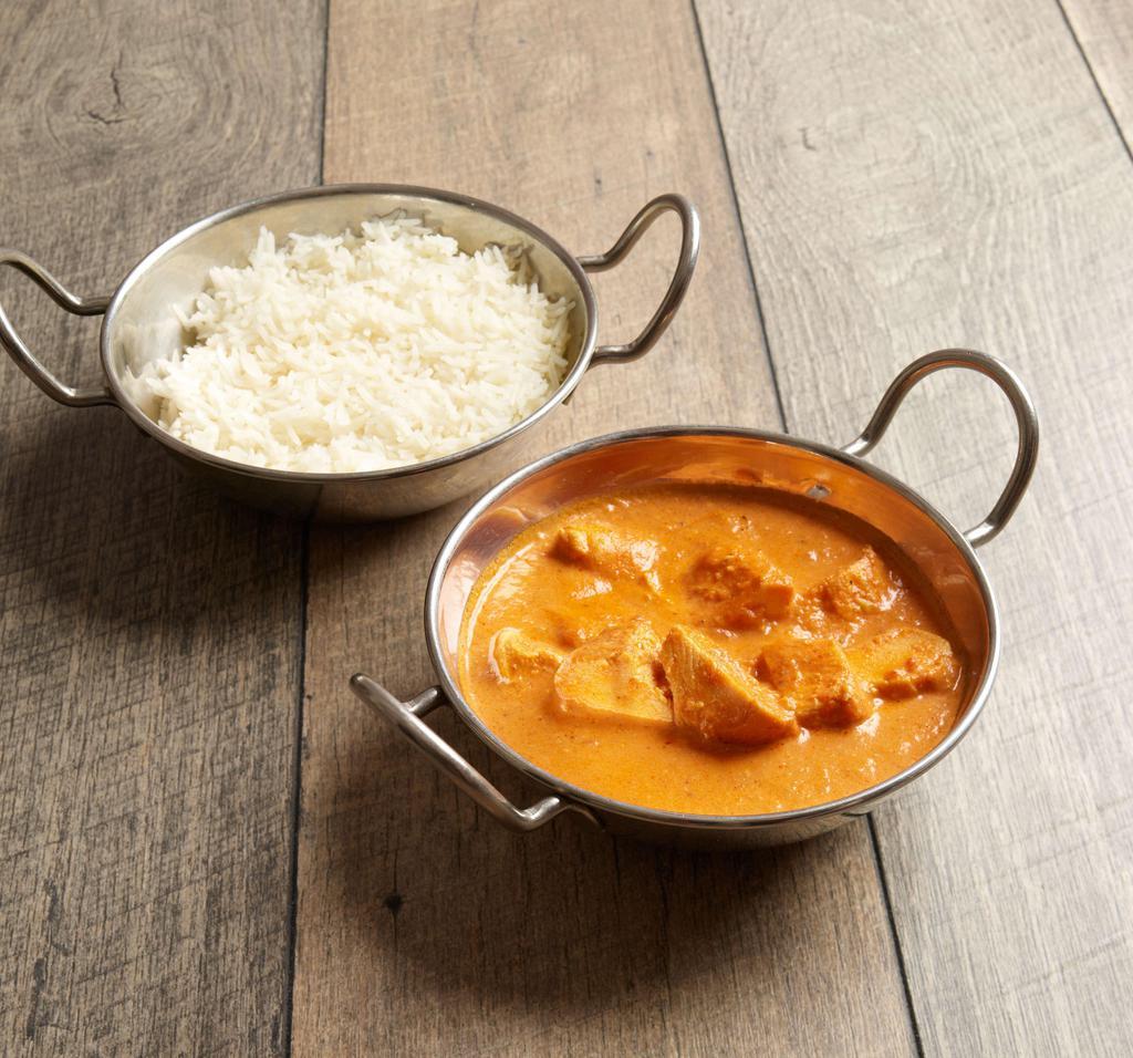 Chicken Makhani · Tender boneless pieces of tandoori chicken cooked in fresh tomato sauce with a touch of light cream and house seasonings.