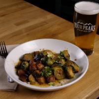 Miso Brussels & Pork Belly · Oven-roasted brussels sprouts tossed in miso sauce with Peach Ale-braised pork belly.
