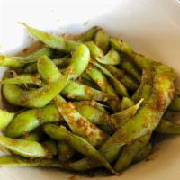 Sweet & Spicy Edamame · Wok seared edamame tossed with sauteed garlic and a sweet & spicy soy glaze, garnished with ...