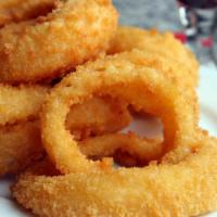 Onion Rings · Thick slices of onions in a crunchy battered, served golden brown with a side ketchup.