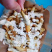 Garlic Fries · 1 lb. of golden hand-cut russets smothered in garlic herb aioli and sheep-milk feta.