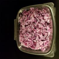 Purple Slaw · Our famous delicious purplicious slaw made of red cabbage, mayo, fresh lemon juice and spices.