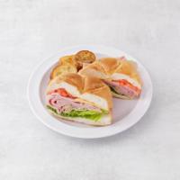 22. Ham Sandwich · Served with lettuce, tomato and cheese. Pickles and home chips.