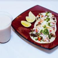 Adobada Pork Taco · Served with cream, cheese, onion and cilantro on a 6