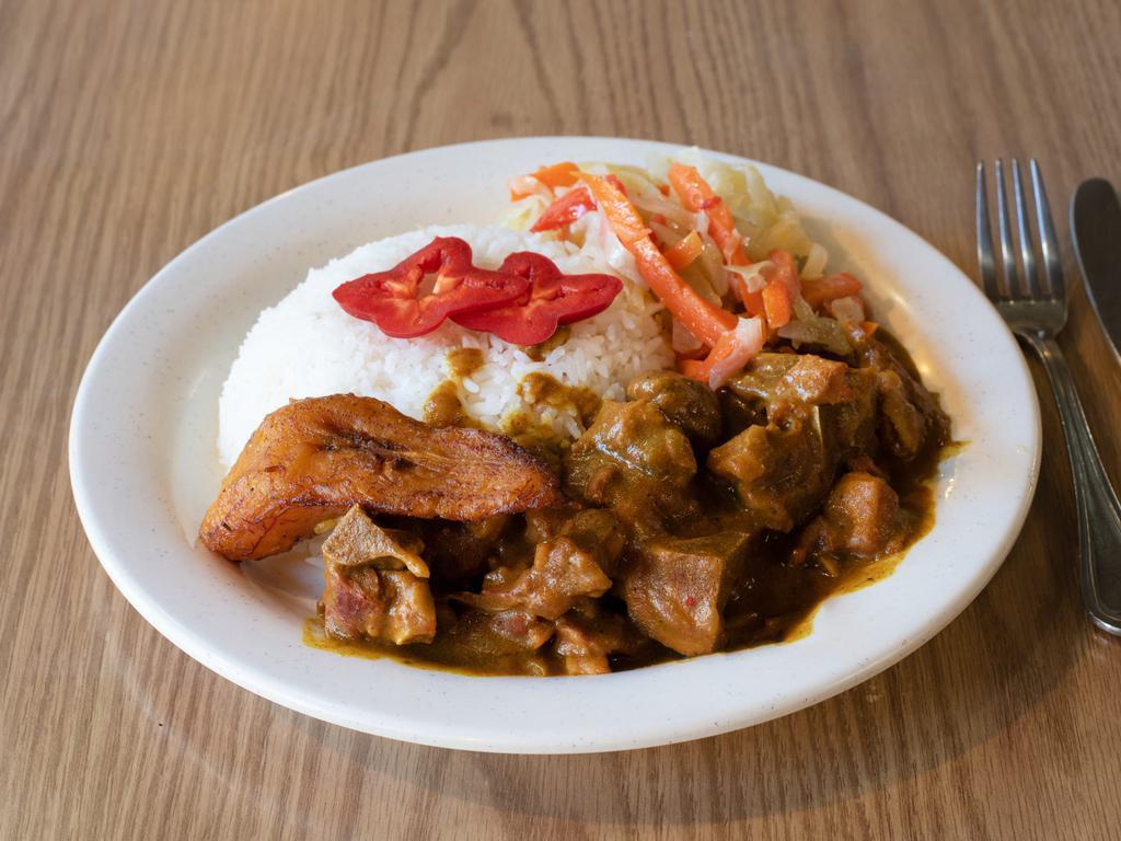 Curry Goat Dinner · Curry stewed goat meat simmered to tenderness.
