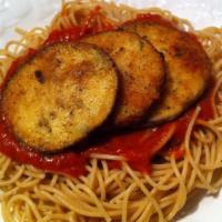 Eggplant Parmigiana · Breaded, sliced eggplant topped with marinara sauce and mozzarella cheese on a bed of spaghe...
