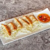 Pot Stickers · Pan seared chicken pot stickers served with ponzu sauce.