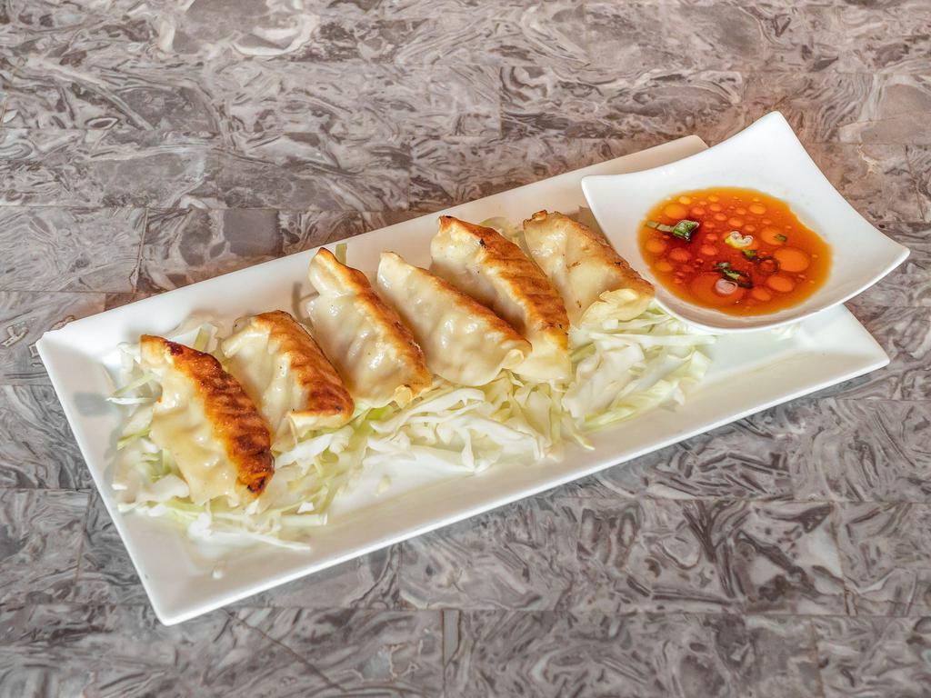 Pot Stickers · Pan seared chicken pot stickers served with ponzu sauce.
