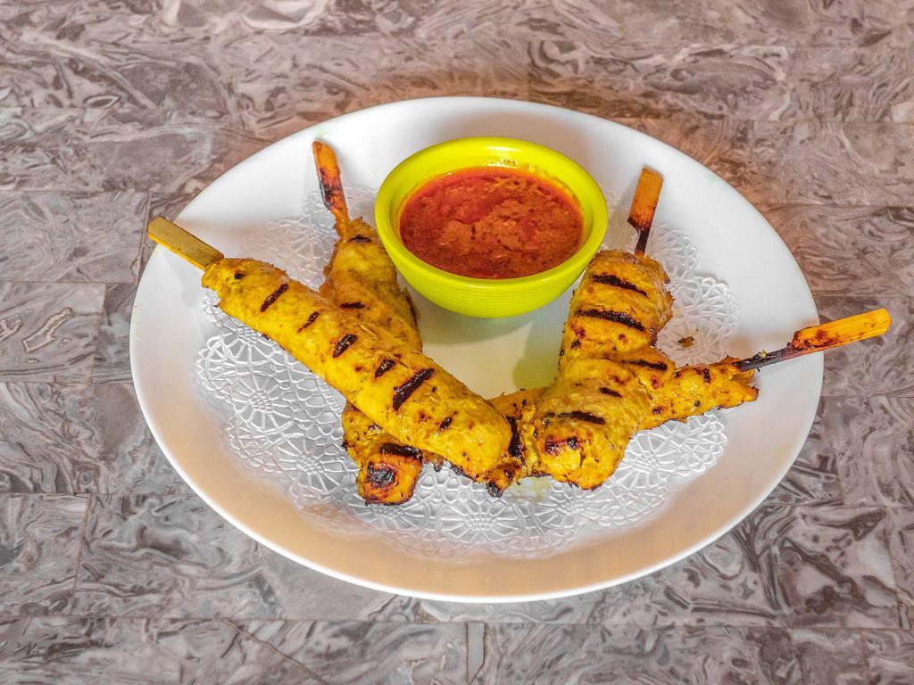 Chicken Satay · A dish of seasoned, skewered and grilled white meat, served with a peanut sauce.