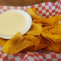 Chips and Queso · A basket of tortilla chips served with Pop’s cheese dip.