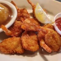 Butterfly Shrimp Basket · Lightly breaded and fried butterfly shrimp with a side of cocktail sauce. Served with 1 side