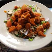 Buffalo Chicken Salad · Crispy buffalo chicken tenders on a bed of mixed with shredded carrots sliced red onion, sli...