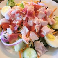 Turkey Bacon Salad · Mixed greens topped with smoked turkey, bacon cheddar-jack cheese, shredded carrots, sliced ...