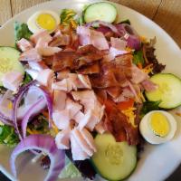 Chef Salad · Mixed greens topped w/ diced smoked turkey breast, smoked ham, crisp bacon, shredded carrots...
