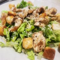 Grilled Chicken Caesar Salad · Grilled chicken breast on a bed of romaine lettuce w/ croutons, parmesan cheese & Caesar dre...