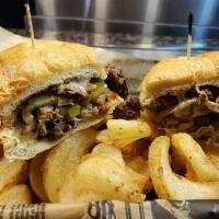 The Philly Sandwich · Grilled steak or chicken covered in mushrooms, peppers, onions and provolone. Served with a ...