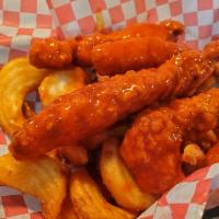 Buffalo Tenders · Fried chicken tenders tossed in buffalo sauce & served with a side item and dipping sauce