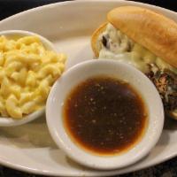 Country Dip · Tender shreds of beef roast topped with melted provolone cheese, served on a toasted hoagie ...