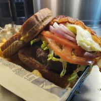 Chuck Burger · Hand-pattied burger grilled to perfection w/ sliced bacon, fried egg, lettuce, tomato, red o...