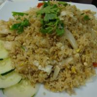 Thai Fried Rice · Thai fried rice with egg, onion, scallions and tomatoes.