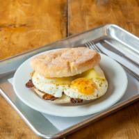 The Big Messy · 2 farm eggs on homemade English muffin with backyard bacon, bacon sausage or ham, and smoked...