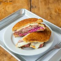 Reuben Sandwich · House-made pastrami, coleslaw, Swiss, and Russian dressing on rye.
