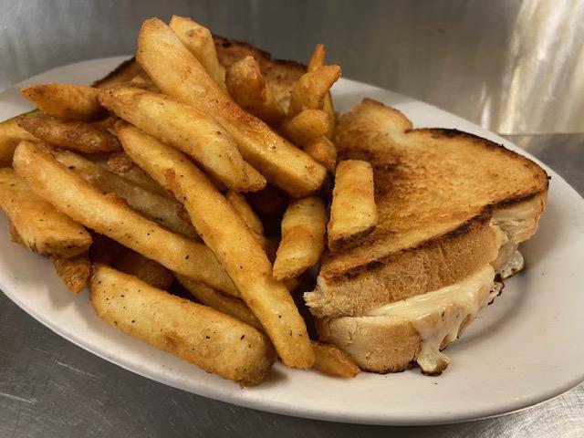 Grilled Cheese Sandwich · American cheese slices sandwiched inside of 2 large slices of sour dough bread grilled to perfection, and served with your choice of a side. Premium sides available.
