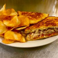 Turkey Melt Sandwich · Lightly grilled turkey, American cheese, bacon and tomato. Served on grilled sourdough bread...