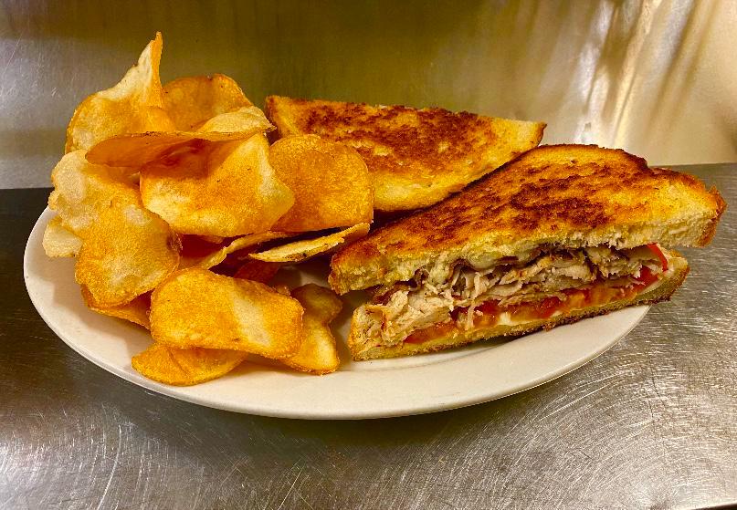 Turkey Melt Sandwich · Lightly grilled turkey, American cheese, bacon and tomato. Served on grilled sourdough bread. Served with your choice of a side. Premium sides available.
