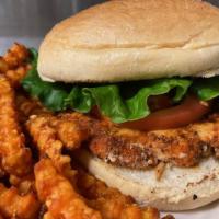 Grilled Cajun Chicken Sandwich · Grilled Cajun chicken topped with lettuce and tomato. Served on a grilled kaiser roll. Serve...