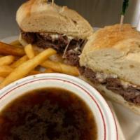 French Dip Au Jus Sandwich · Roast beef and melted provolone cheese.
Served on a soft, grilled French baguette.