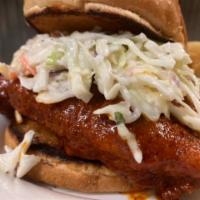 Fire In The Hole · Fried chicken dipped in our Nashville hot sauce and topped 
with coleslaw. Served on a soft,...