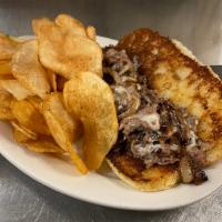 Prime Rib Cheese Steak · Slow roasted prime rib, sautéed onions, and American 
cheese. Served on a soft, grilled brio...