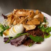 Brown Derby Cobb Salad · Salad greens, cheddar cheese, crumbly blue, tomatoes,
bacon, scallions, hard-boiled egg, and...