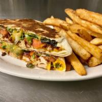 Cajun Crunch Wrap · Romaine, ranch dressing, bacon, cheddar, tomatoes,
and Cajun grilled chicken all wrapped up ...