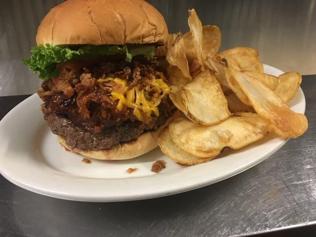 Barnyard Shuffle Burger · ½ pound Angus burger topped with pulled pork,
tangy BBQ sauce, cheddar cheese, and onion straws.