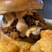 Blooming Onion Burger · ½ pound Angus burger topped with grilled onions,
provolone cheese, onion straws, and onion b...