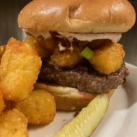 Spud Muffin Burger · ½ pound Angus burger topped with tater tots, cheddar cheese, 
bacon pieces, scallions, and a...