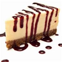 NY Style Cheesecake · Creamy cheesecake topped with your choice of raspberry sauce, or chocolate sauce and whipped...