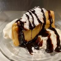 Deep Fried Cheese Cake · We start with our creamy cheese cake , wrap it in a tortilla shell and deep fry it to perfec...