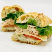 Turkey & Swiss Sandwich · Roasted, smoked or honey smoked turkey breast with swiss cheese, lettuce, tomato, pickle, on...
