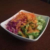 Ginger Miso Salad · Lettuce, cabbage, carrots, and ginger miso dressing.