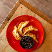 Fried Pork Dumplings (5pc) · 5 pieces. Pork dumplings deep fried and served with house-made ginger soy dipping sauce.