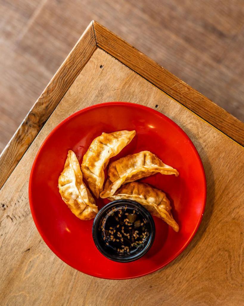 Fried Pork Dumplings (5pc) · 5 pieces. Pork dumplings deep fried and served with house-made ginger soy dipping sauce.