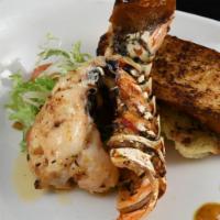 Spiny Lobster Tail · Half of an 8 oz Spiny Lobster Tail, Broiled with Preserved Lemon Scampi Butter (preserved le...