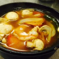 16. Tom Yum Goong  · Spicy and sour prawns and mushroom soup with a touch of lemon grass in roasted chili aroma.