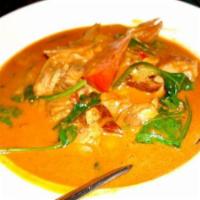 30. Gang-Ped-Ped-Yang  · Roast duck curry cooked in coconut milk and red chili sauce with a combination pineapple and...